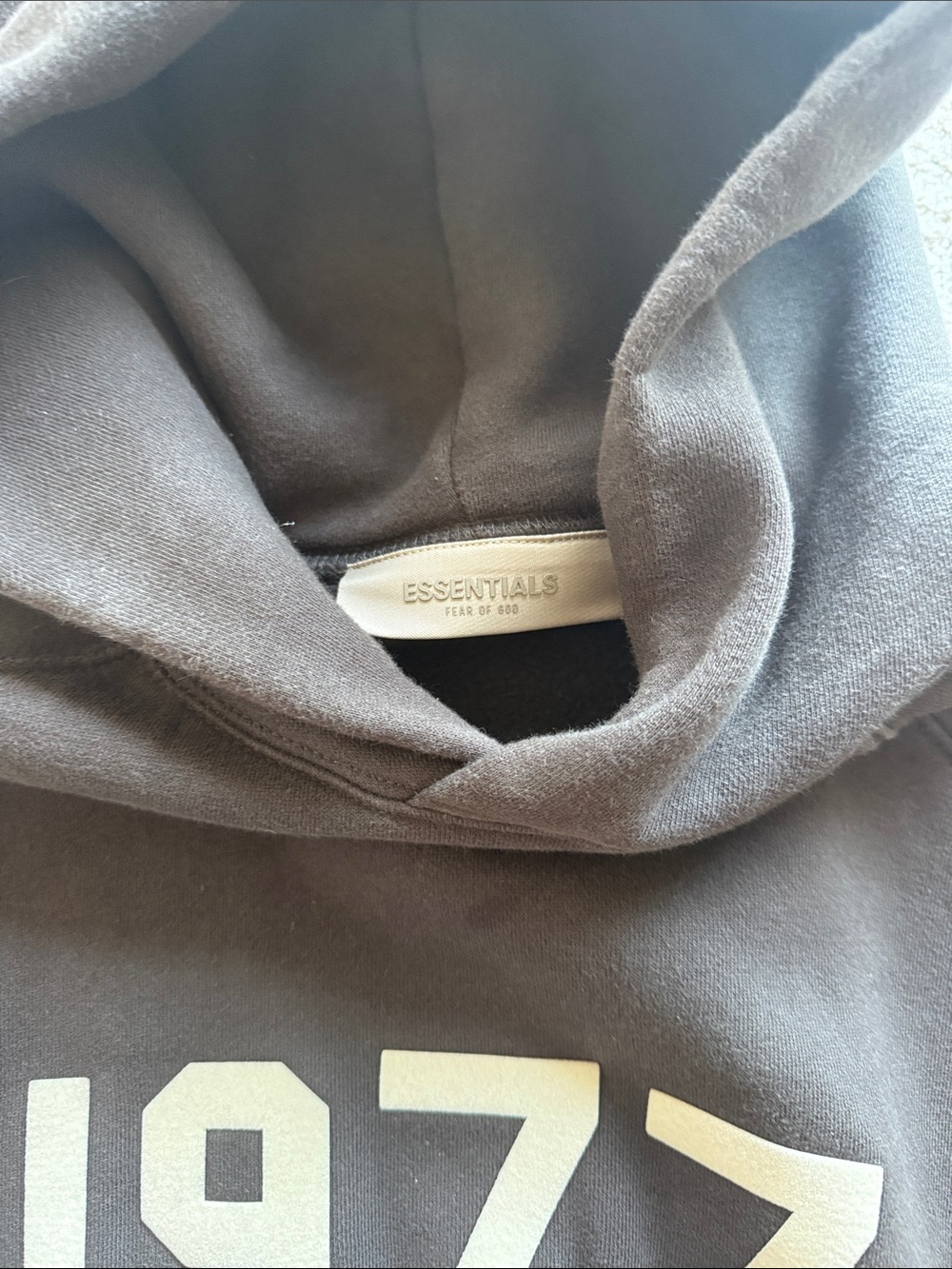 ESSENTIALS Hoodie in Charcoal with Cream '1977' Graphic - Picture 2 of 3